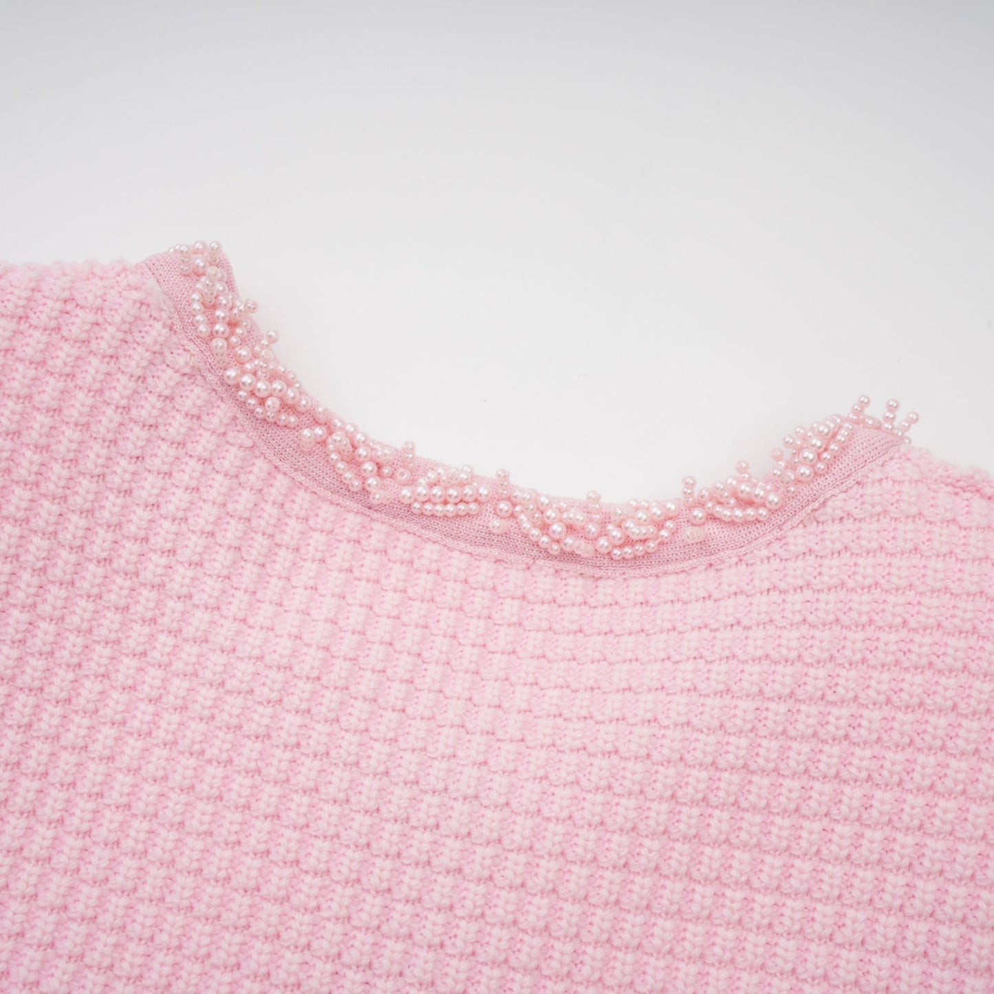 A pink mini dress with a knit texture and beaded embellishments named Eugenie