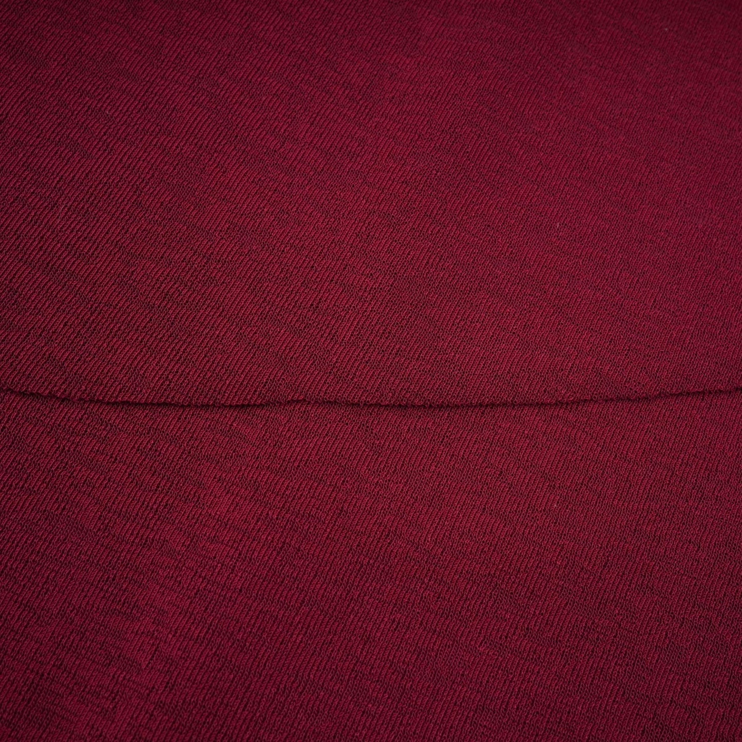A red midi dress with ruched detailing and a flap design named Camille