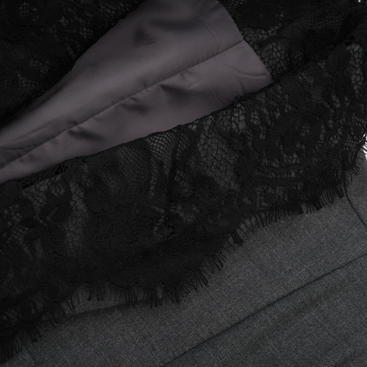 A grey blazer with lace panel detailing featuring a tailored silhouette and elegant design