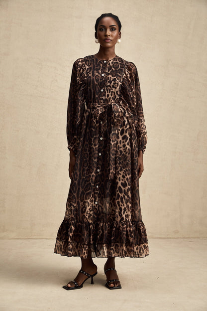 A leopard print midi dress with a single breasted design featuring the Gisele style