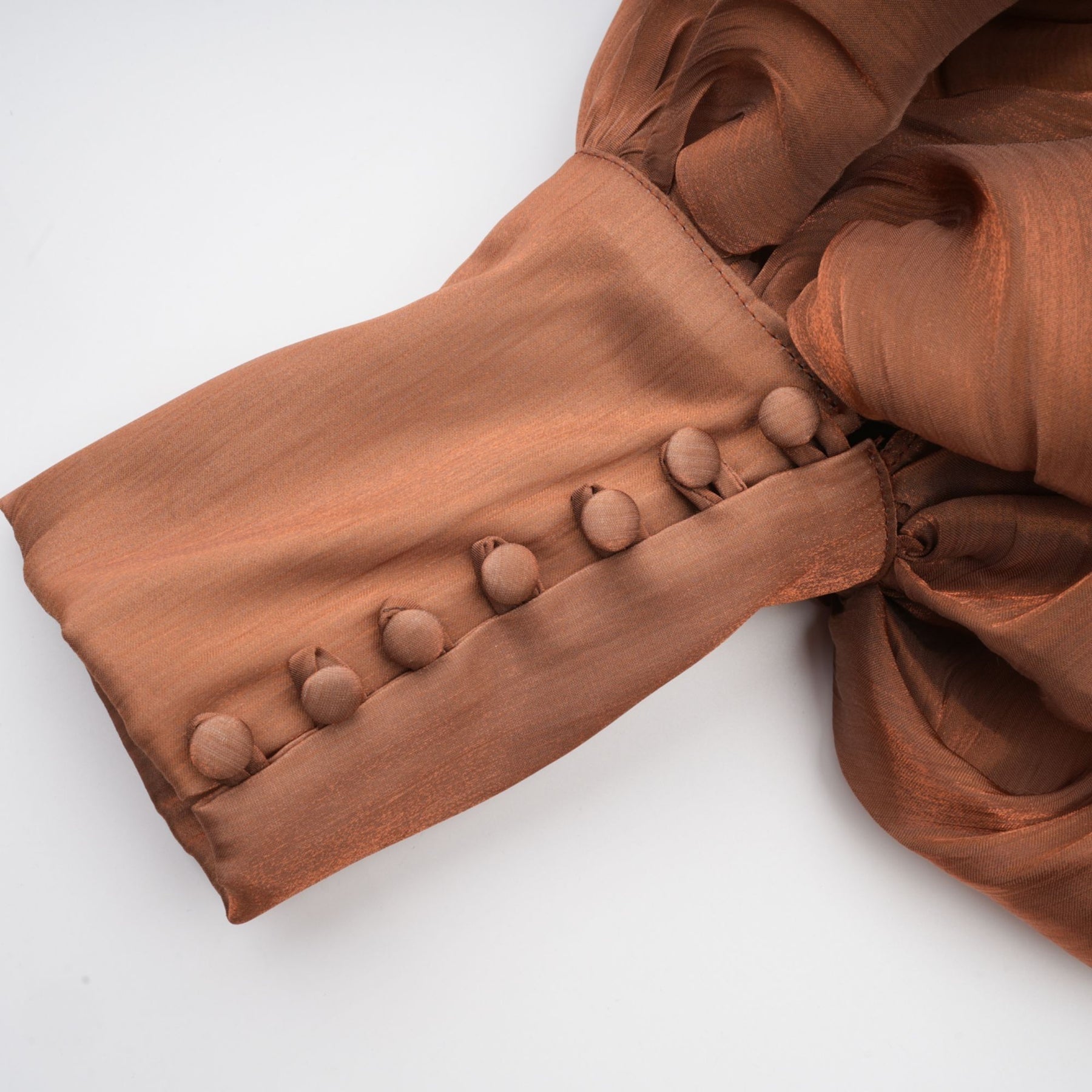 Brown pleated satin maxi dress with long skirt and elegant drape