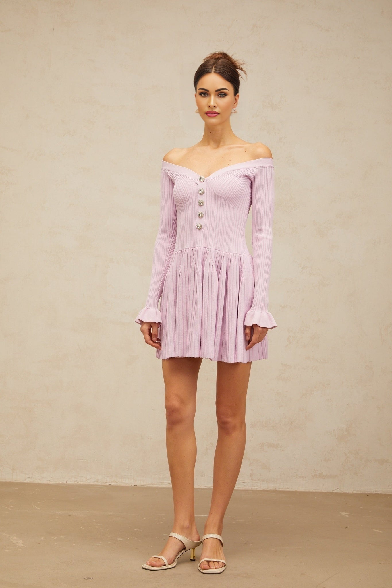 A light purple offshoulder mini dress with ribbed knit fabric featuring a closefitting silhouette and short length