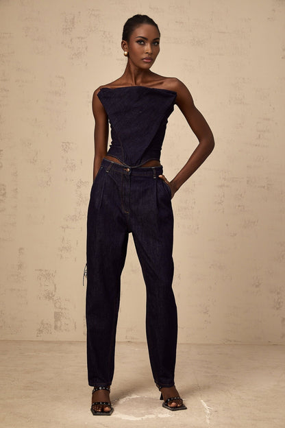 A dark blue offshoulder denim top from Kleber worn by a model against a plain background