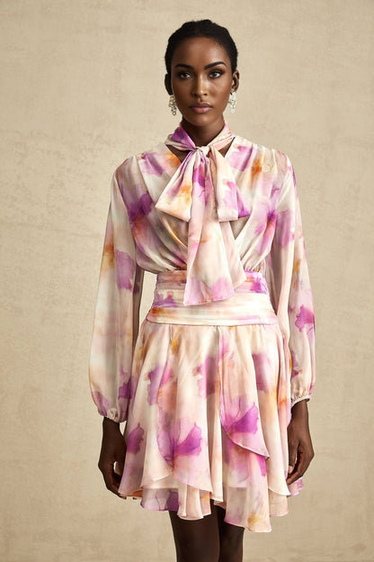 A short floral print dress with a V neckline and mini length from the brand Maelys