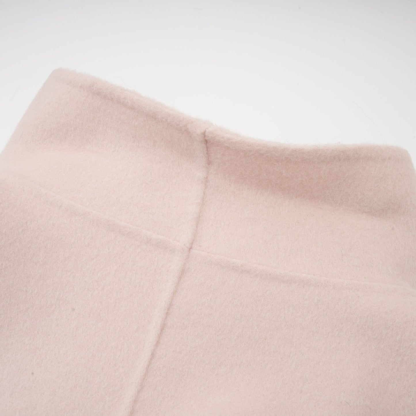 A short pink coat with a diagonal placket closure named Vienne featuring a feminine design and stylish cut