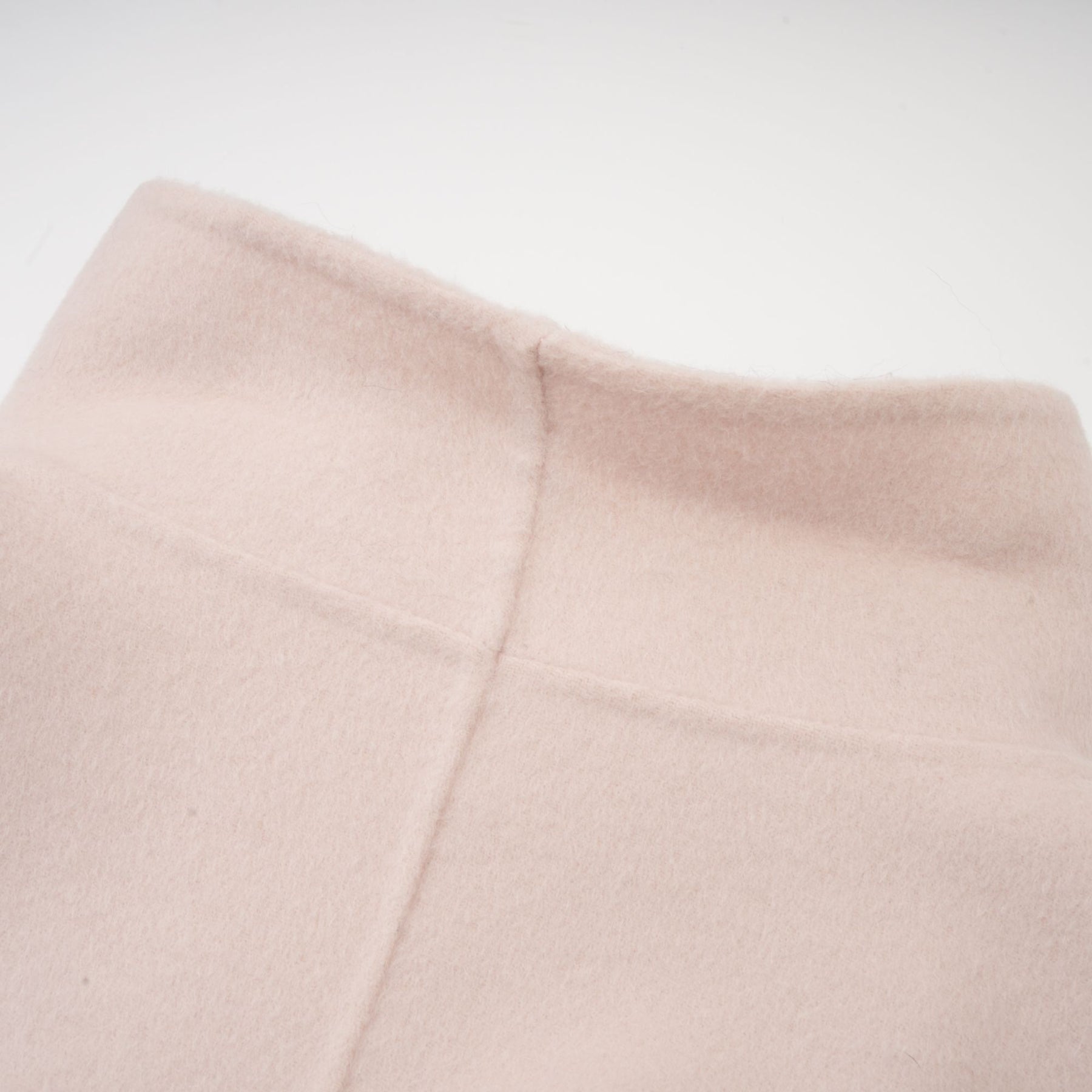 A short pink coat with a diagonal placket closure named Vienne featuring a feminine design and stylish cut
