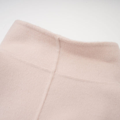 A short pink coat with a diagonal placket closure named Vienne featuring a feminine design and stylish cut
