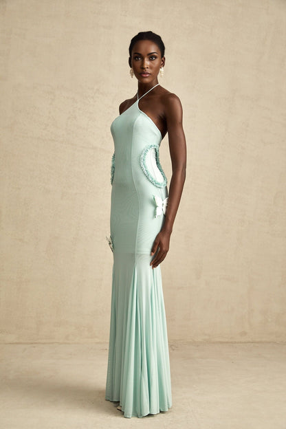 A long flowy maxi dress with ruffle details and a butterfly pattern named Amelie