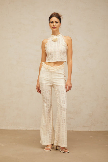 Cream white matching set featuring a jacquard top with ruffled lace trim and coordinating trousers