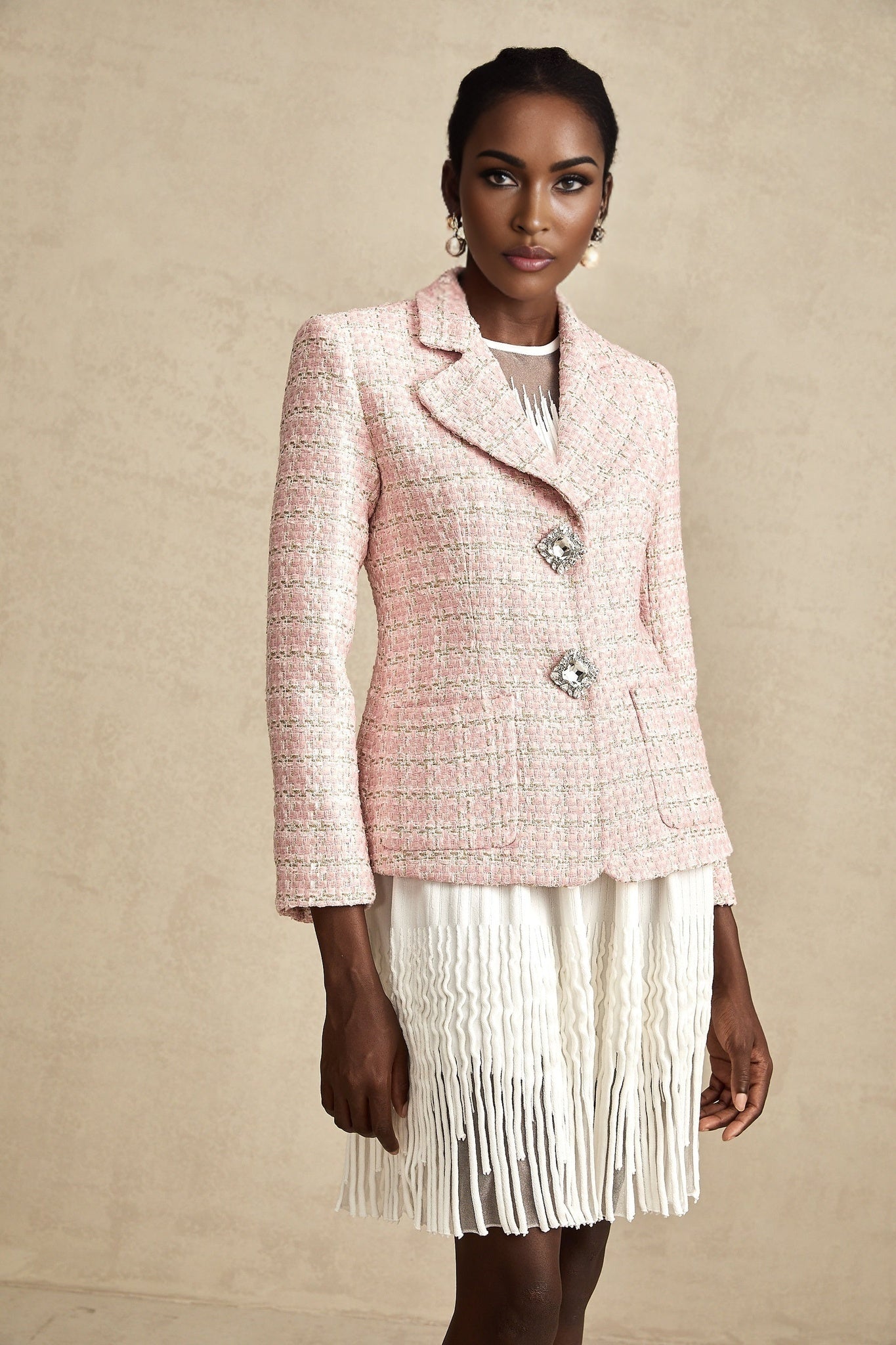 A pink blazer with a crystal checked tweed pattern featuring a tailored fit and classic silhouette