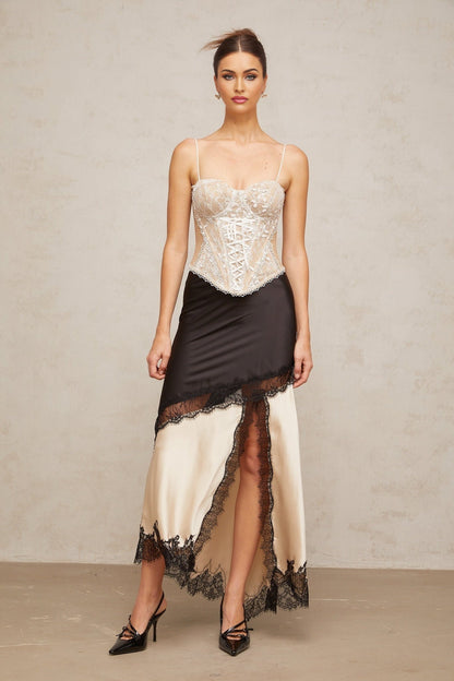 A bustier top with a floral lace design featuring panelling named Karine