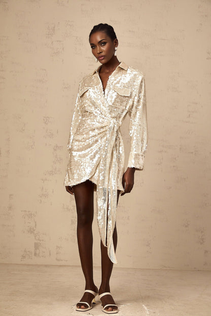 A short sequined mini dress with a wrap design and shirt collar in a shimmering fabric featuring long sleeves and a cinched waist