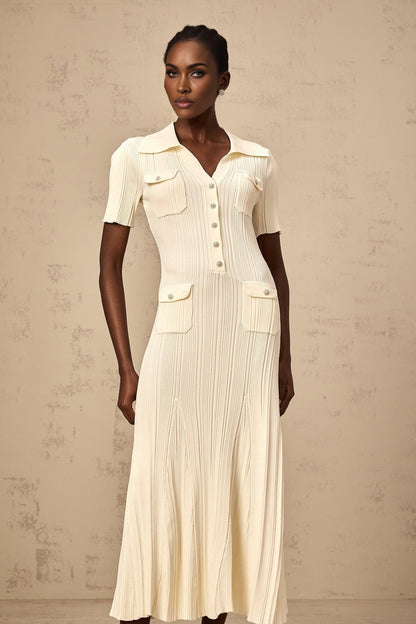 Woman wearing a neutralcolored ribbed knit midi dress with long sleeves and a formfitting silhouette
