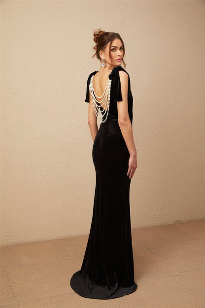 A long black velvet maxi dress with an open back and embellished details named Audrey