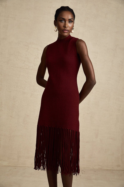A red knitted midi dress with fringe details designed by Celine