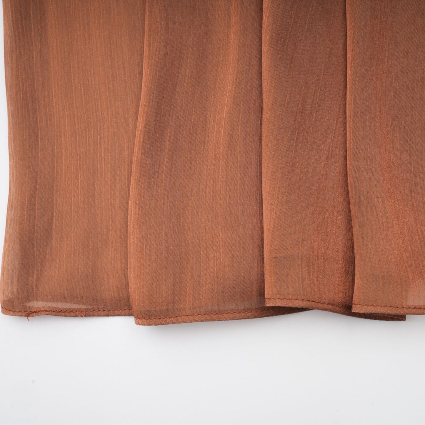 Brown pleated satin maxi dress with long flowing skirt and elegant design