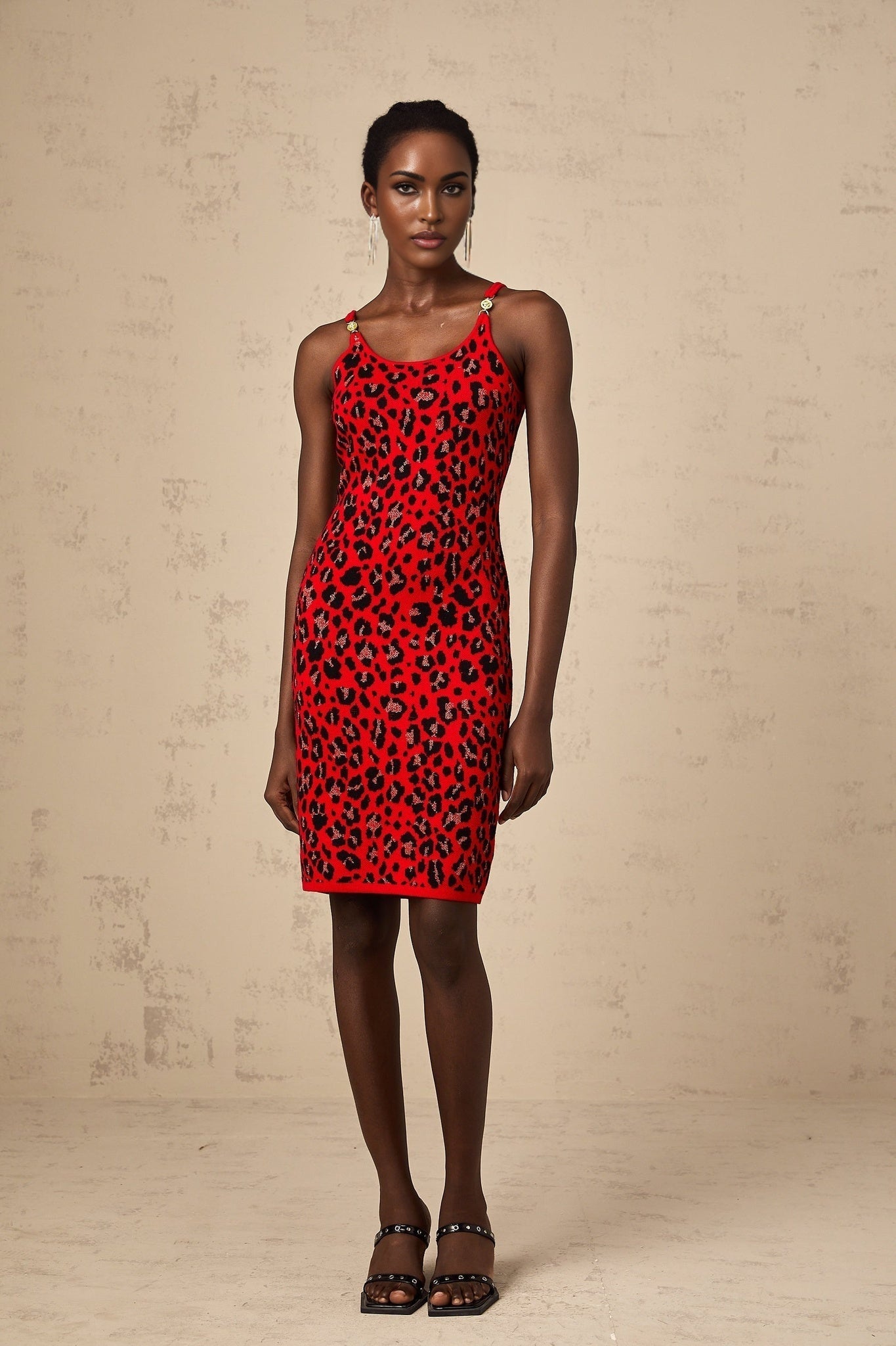 A red mini dress with a leopard print pattern made from shimmering lurex fabric