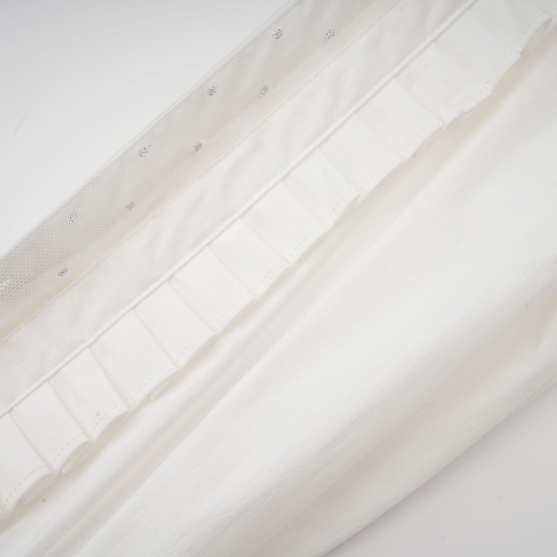 Céleste white pleated scarfcollar shirt
