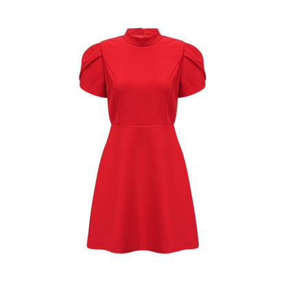 A red mini dress with petal sleeves and a cutout design featuring a bow detail
