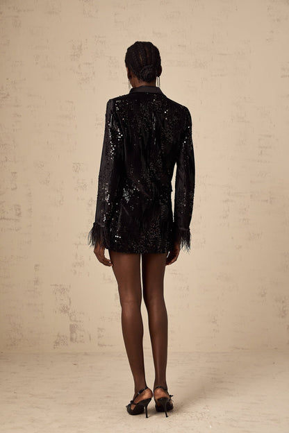 A black blazer with sequin embellishments and feather trim details