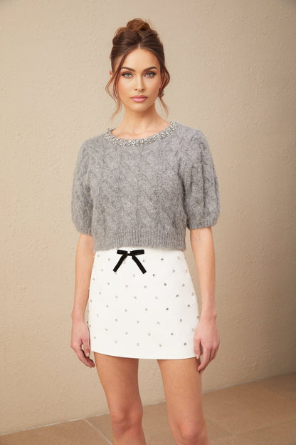 A cropped mohair sweater in a cable knit pattern with embellishments named Ophélie featuring a short length and textured design