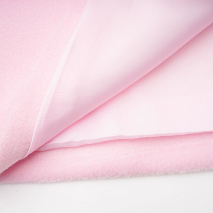 A pink faux fur overcoat with a plush texture and long length named Louisette