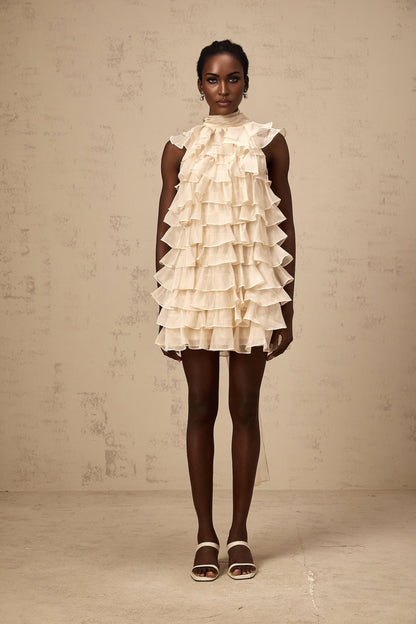 A sleeveless mini dress with tiered flounce details called Jessica featuring multiple layers of ruffles on a short skirt