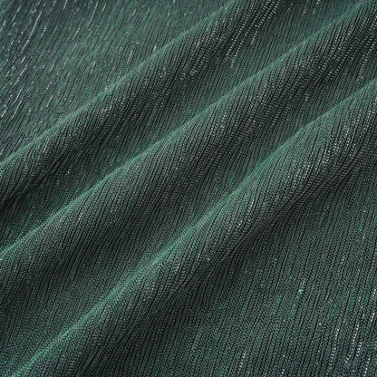 A green maxi dress with a corsetstyle bodice featuring ribbon detailing and a flowing long skirt