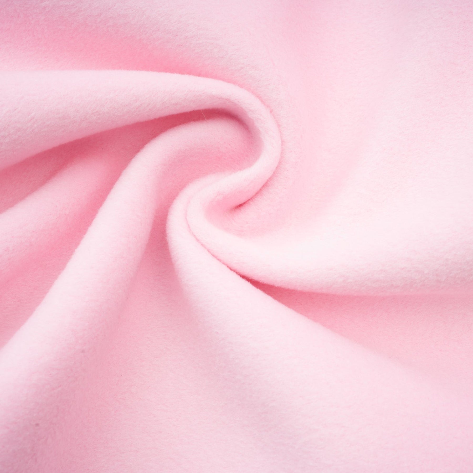 A pink faux fur overcoat called Louisette shown on a mannequin or model against a plain background