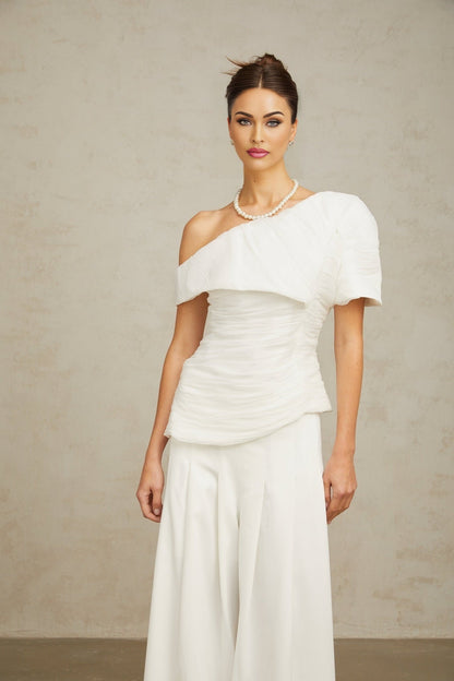 Adele white matching set featuring a creased top and trousers