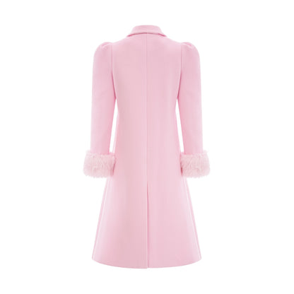 A pink overcoat made of faux fur with a luxurious fluffy texture and long sleeves called Louisette