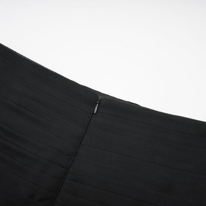 A long flowing maxi skirt with layers of ruffled tulle fabric in a pleated design featuring a rayon waistband