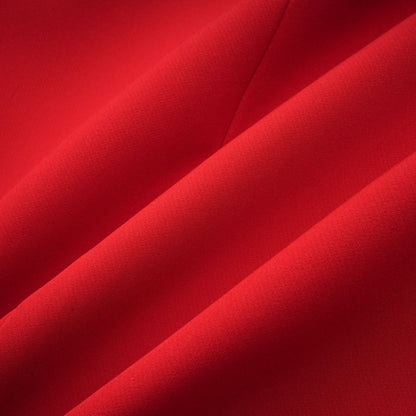 A red blazer with an hourglass silhouette featuring double breasted buttons and a tailored fit