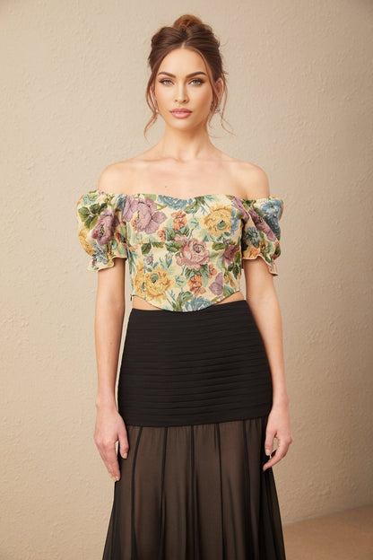 A cropped top featuring a floral print pattern on jacquard fabric with the name Constance