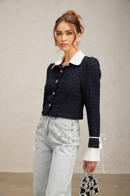 A navy blue tweed jacket with panelled design called Doriane