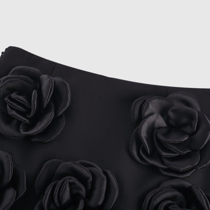 Black mini skirt with artificial flowers by Nalini