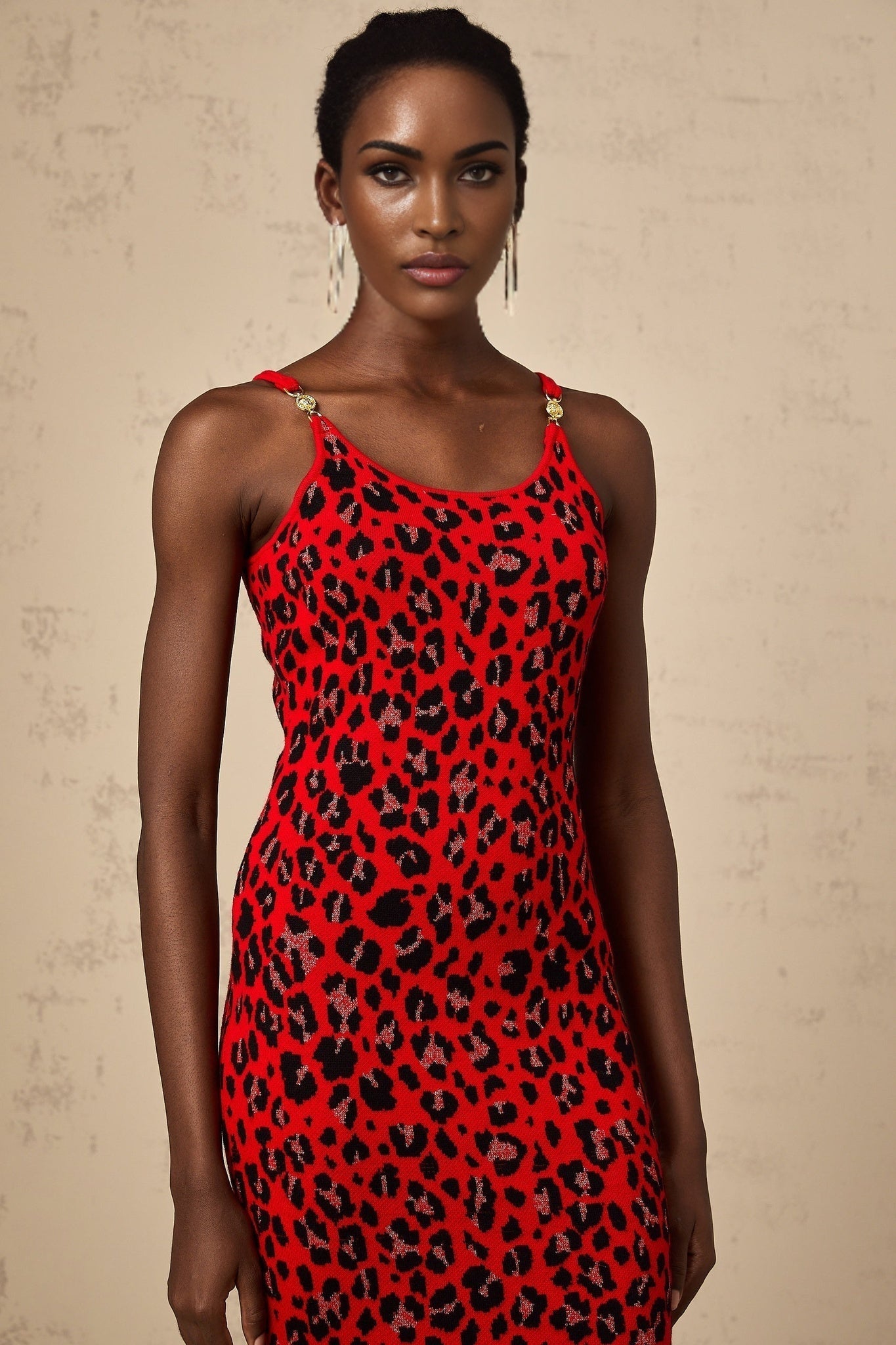A red mini dress with leopard print pattern and shimmering lurex fabric