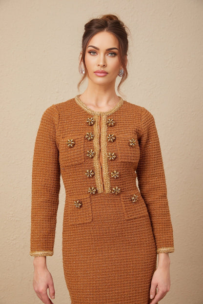 A brown tweed dress with braided edge details and a classic Epona design