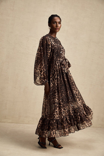 A leopard print midi dress with a single breasted design featuring the Gisele style