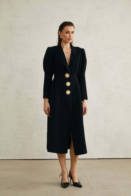 Black single breasted long coat by Aelle