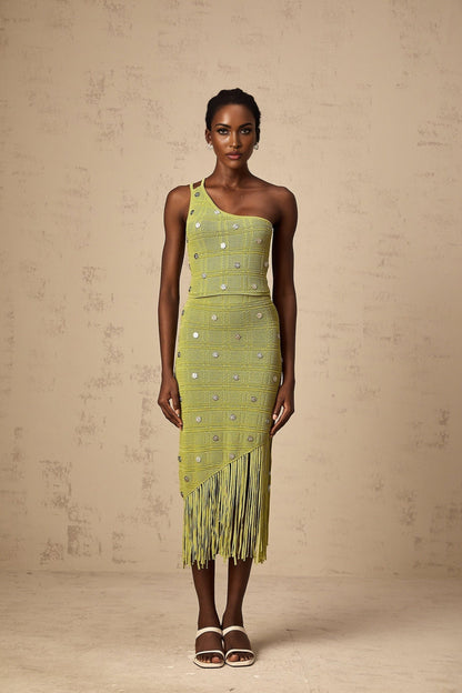 Woman wearing green knit top and skirt set with embellishments named Annette