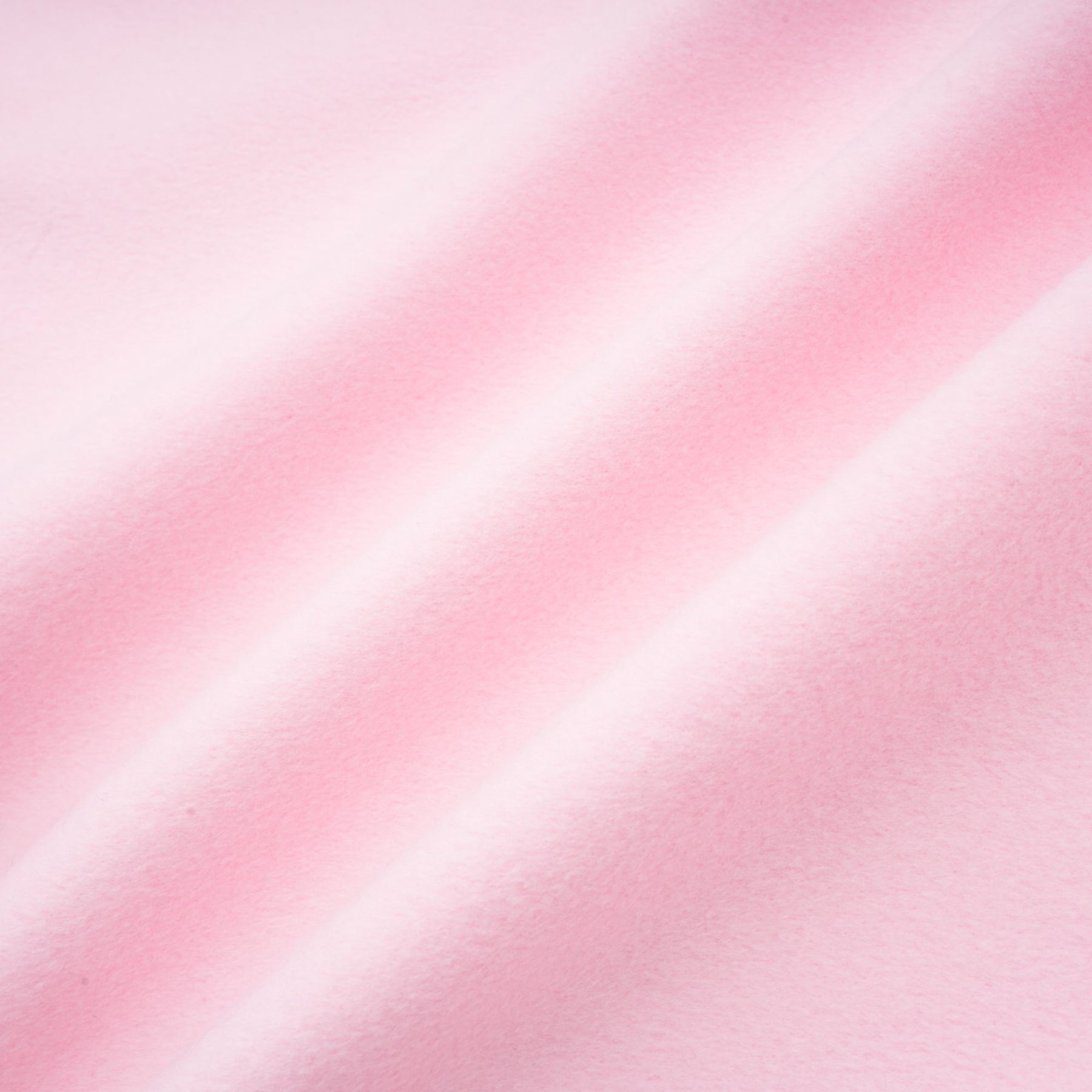 A pink faux fur overcoat with a plush texture and long length for winter warmth