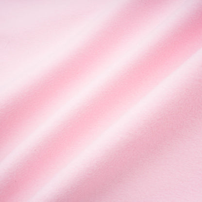 A pink faux fur overcoat with a plush texture and long length for winter warmth