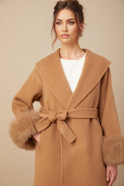 A woman wearing a long brown woolen wrap overcoat with a felted texture and a loose fit