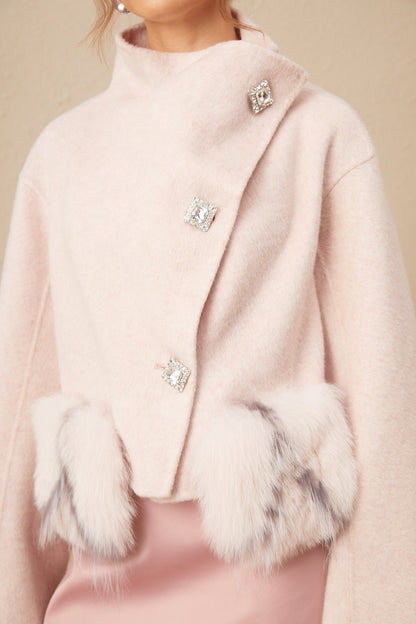 A short pink coat with a diagonal placket closure and a stylish design named Vienne