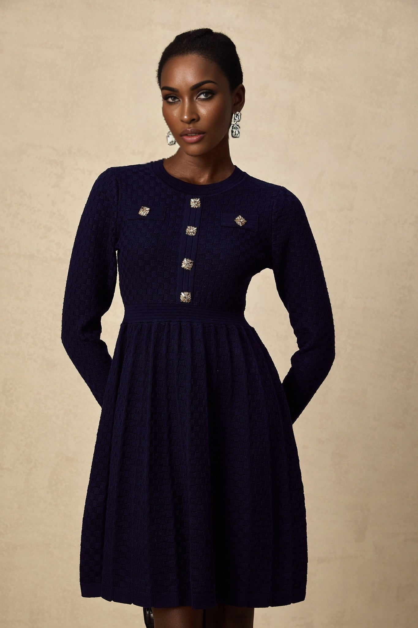 Navy blue mini dress with basket weave pattern short sleeves and fitted silhouette