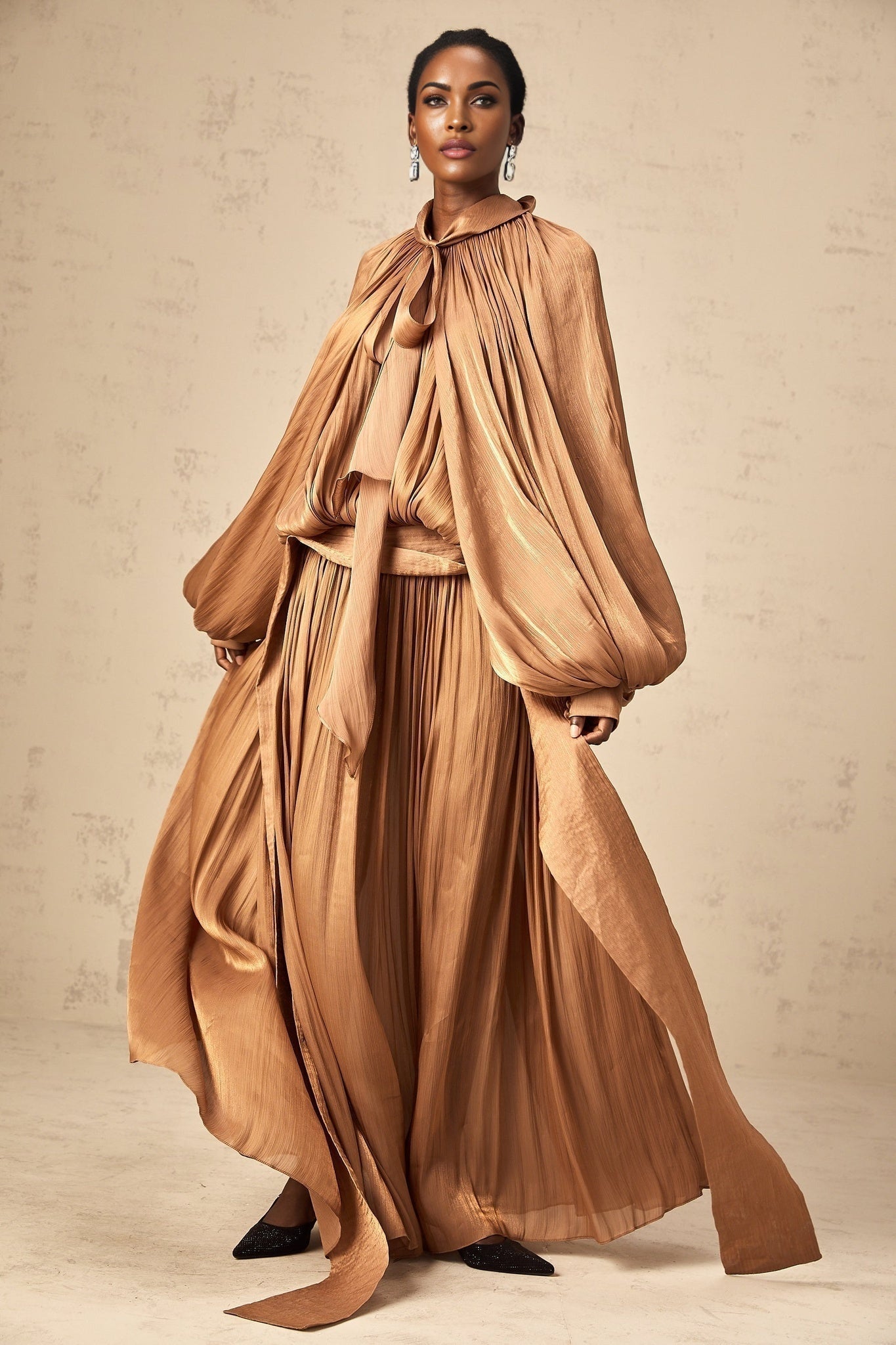 Mila brown pleated satin maxi dress on display