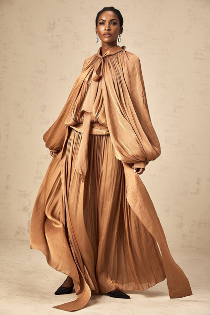 Mila brown pleated satin maxi dress on display