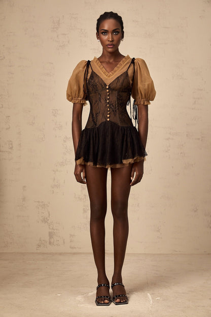 A black mini dress with lace panels featuring a fitted silhouette and delicate lace detailing throughout the bodice and sleeves