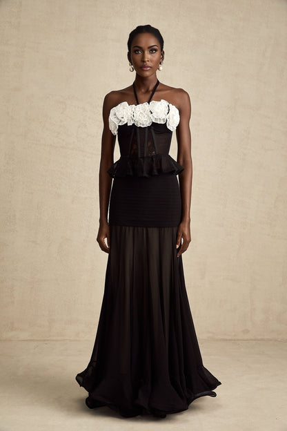 A black corset top with faux flower lace detailing featuring a fitted silhouette and sweetheart neckline